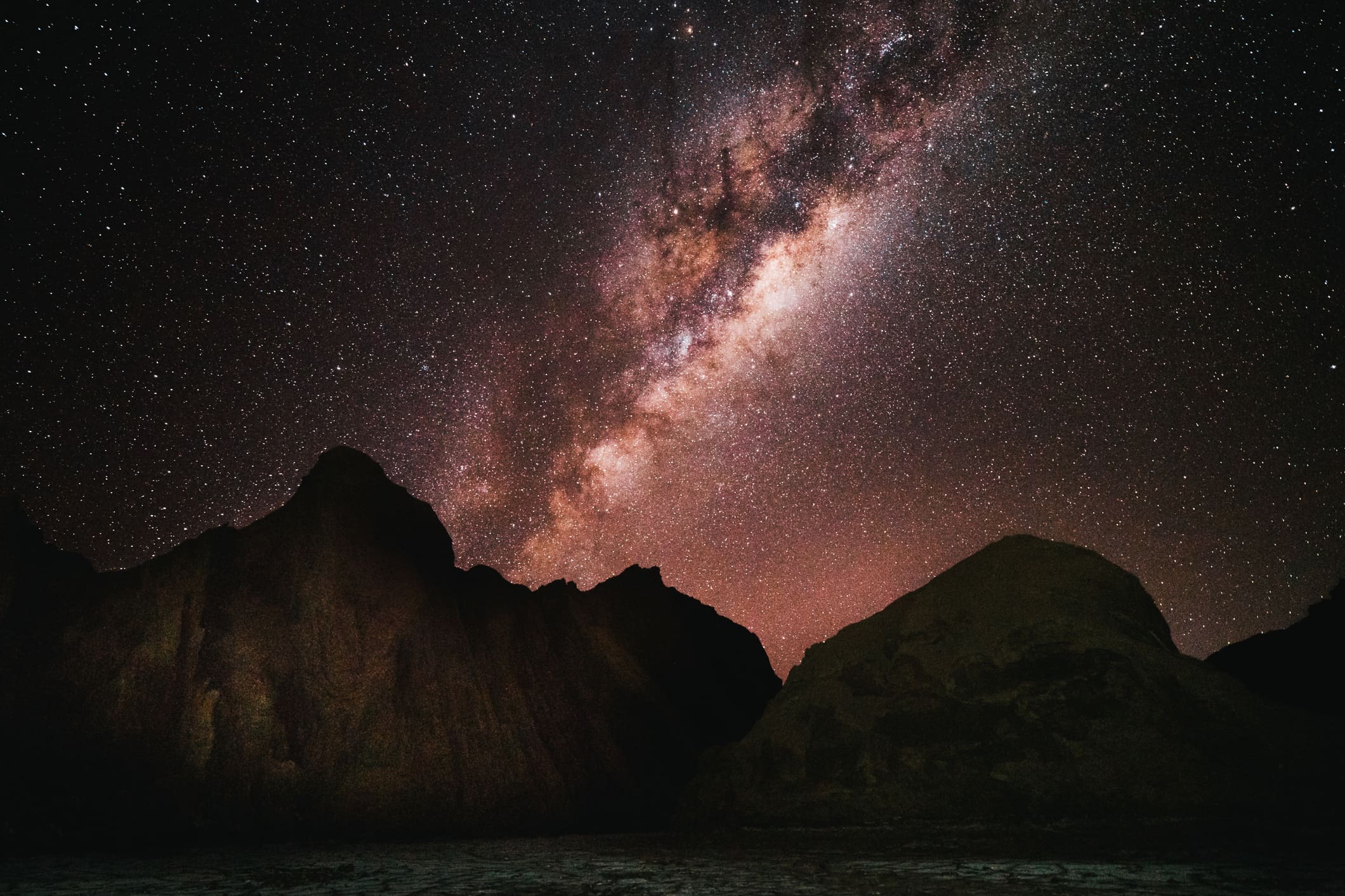 Milky Way above dark mountain peaks